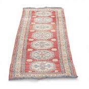 Extra Wide Hall Runner in oriental Kazak design in red, blue cream pattern with a blue fringe.
