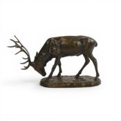 Gilded bronze figure of a stag with head down, 12cm.