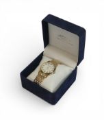 Tissot PR100 quartz watch with silver-tone dial and stainless steel bracelet, with spare link, boxed