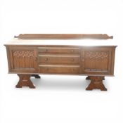 Priory style dark oak linen fold sideboard, with 3 central drawers flanked by cupboards with gallery