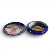 Moorcroft small bowl in the Berry and Leaf pattern on blue ground, together with pin dish in the