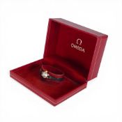9ct gold ladies wrist watch with Omega display box. Winds, ticks, sets & runs.