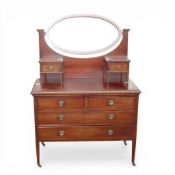 An Edwardian mahogany inlaid dressing table with an oval tilting mirror, H153cm x W106cm x D50cm.