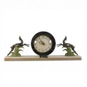 French Art Deco mantle clock featuring a marble base with jumping deer and a circular clock