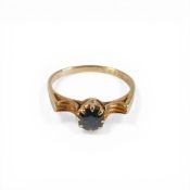 Yellow metal ring set with single dark blue sapphire stone, electronically tested to be 18ct gold,
