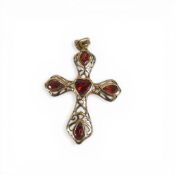 9ct gold cross set with dark orange stones, h.4cm,2.1g.