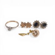 A collection of 9ct gold earrings and a yellow metal diamond ring, electronically tested to be 9ct