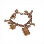 9ct gold charm bracelet, containing 14 9ct gold charms including one containing a ten shilling note,