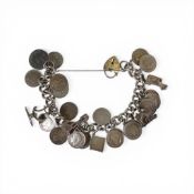 Silver charm bracelet having many pre-47 Silver threepences and One 9ct gold charm attached, 88.6g.