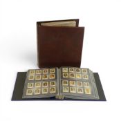 A collection World Stamps, presented in leather-bound album, together with empty leather folder.