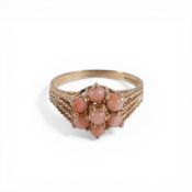 9ct gold ring set with a cluster of coral coloured stones, size N, 2.5g.