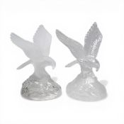 A pair of vintage Cristal d'Arques lead crystal eagle figurines, featuring an eagle with spread