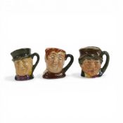 Three Royal Doulton tiny character jugs, Fat Boy, Paddy and Micawber, each painted slightly