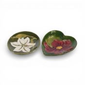 Moorcroft pin dish in the Bermuda Lily pattern on green ground, and heart-shaped pin dish in the