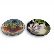 Moorcroft pin dishes compromising the Ivory Bells pattern, designed by Philip Gibson, 2004, and