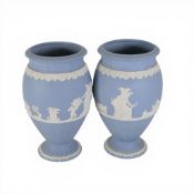 Two Wedgwood Jasperware pale blue Bountiful Vases with white relief depicting classical scenes. H:-