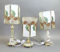 Vintage Tiffany-style table lamps on onyx base with brass or gilt feet, featuring Art Nouveau floral