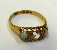 Ladies 18ct gold dress ring set with a central clear stone, 4 further clear stones and 2 opals, size