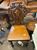 Ornately carved mahogany hall chair
