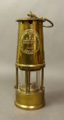An Eccles Type 6 brass miners safety lamp by the Protector Lamp and Lighting Co. Ltd.