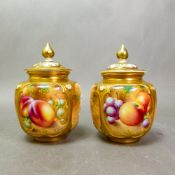 Pair of Royal Worcester hand-painted pot pourri covered vases, signed Roberts, height including lids