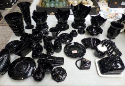 A collection of vintage 'Bagley Jetique' black polka dot art glass items, to include wall pockets