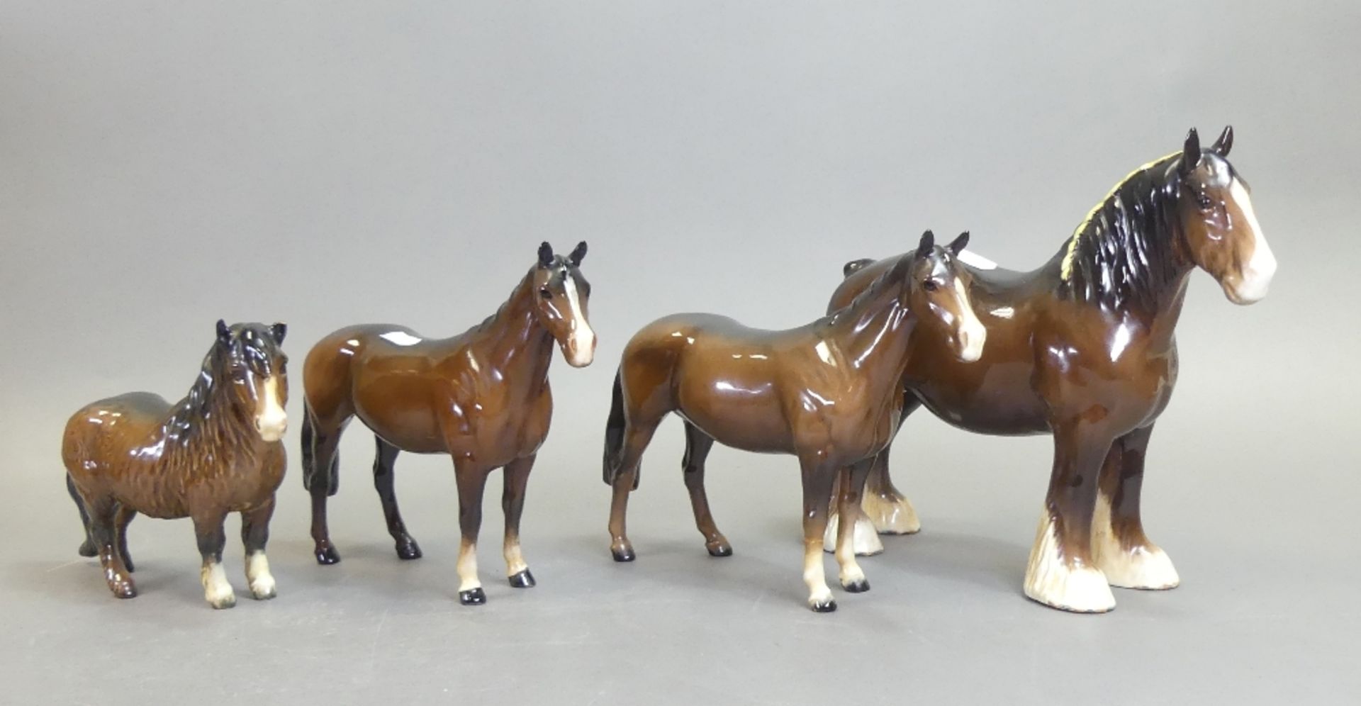 Beswick, bay Shire horse model no.818, Shetland Pony model no.1033 and two Thoroughbred Stallion'