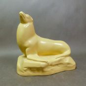 John Skeaping for Wedgwood Etruria, a matt straw figure, of a Sealion, height 20cm.