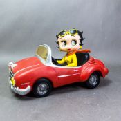 Betty Boop resin figurine sat in a car, King Features Syndicate/GP Securities 2009, length 30cm.