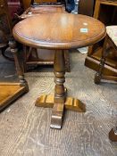 Old Charm wine table on quad form base, diameter of top 48cm