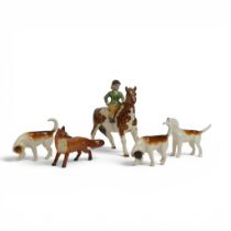 Beswick model of a girl on Skewbald pony, three first version foxhounds and fox. (5)