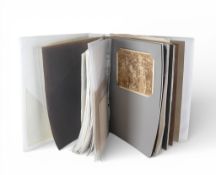 A collectors album containing a small collection of 19th century black & white photographs and