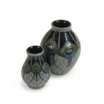 Moorcroft vase decorated in the Peacock parade design, dated 2012 and a similar smaller version,