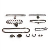 A collection of Silver jewellery including pendants and chains, earrings, bracelets, necklaces etc