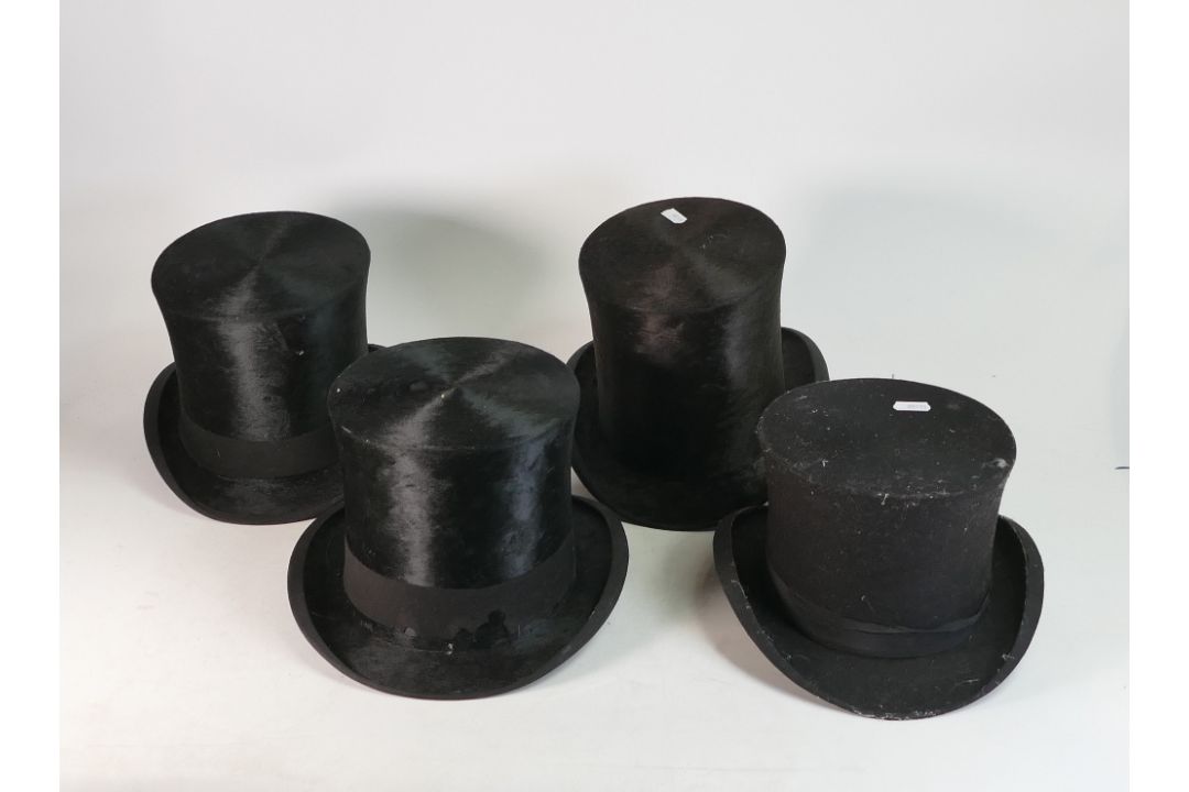 A collection of late 19th/early 20th century black top hats, made from silk plush or fur felt. (4) - Image 2 of 4