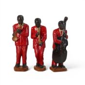 Porcelain Hand Painted part Harlem Jazz Band to include:- Double Base, Sax, Trumpet. Tallest:-