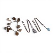Silver charm bracelet and Two Silver pendant & chains each with large stones. (3)