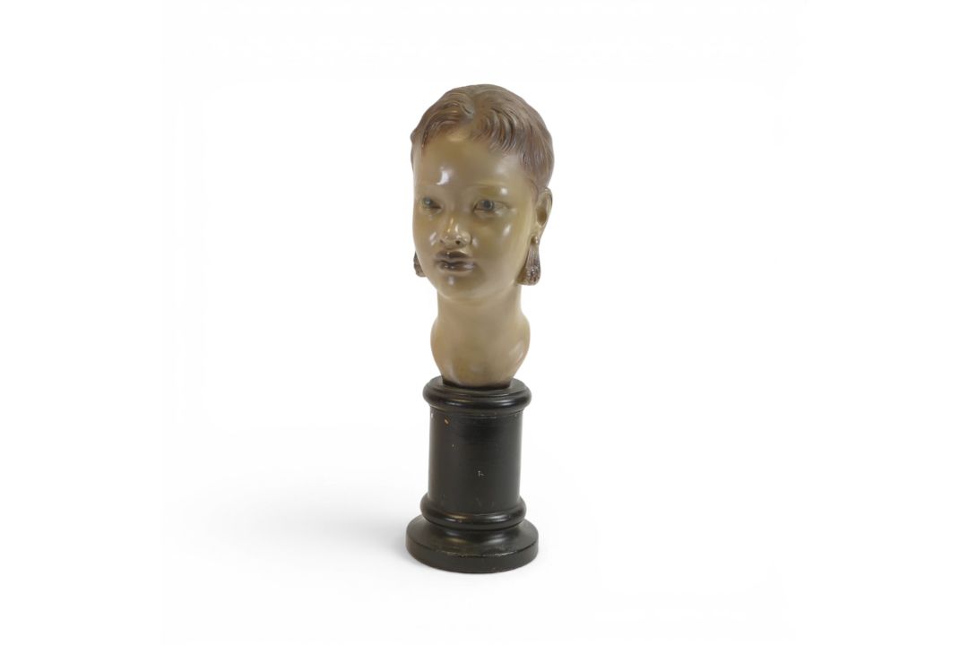Mid-century plaster bust depicting a young woman, on a wooden plinth, marked Reg-887566 o the back - Image 1 of 6