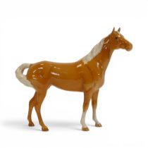 Beswick model of a Palomino Swish Tail, model no.1182.
