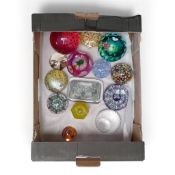 A collection of Glass paperweights featuring intricate millefiori patterns, abstract designs and