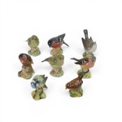A group of Eight Beswick birds to include a Goldfinch model 2273, Blue Tit model 992B, Bullfinch
