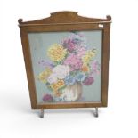 Vintage floral tapestry needlepoint fire screen, featuring a still life of flowers in a vase, housed