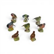 A group of eight Beswick birds to include a Goldfinch model 2273, Bullfinch model 1042, Wren model