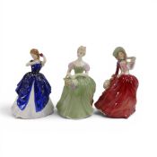 Royal Doulton lady figures featuring Autumn Breeze HN1934, Clarissa HN2345 and Laura HN3136. (3)