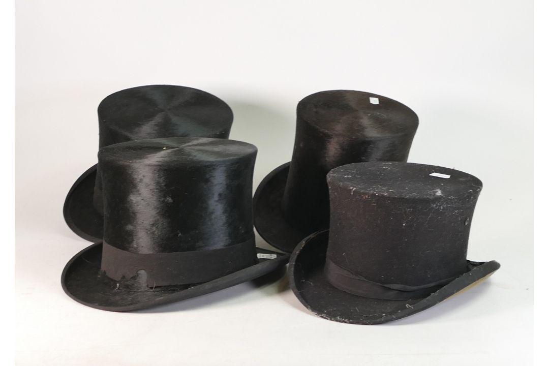 A collection of late 19th/early 20th century black top hats, made from silk plush or fur felt. (4) - Image 4 of 4