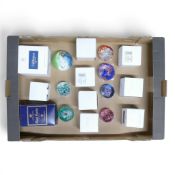 A collection of mainly Caithness glass decorative paperweights featuring intricate millefiori