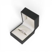 Unworn 9ct white gold crossover diamond ring, size Q. 2.8g.