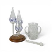 Hand-blown glass oil lamp, featuring teardrop-shaped reservoirs with a cobalt blue dot pattern,