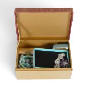 A collection of costume jewellery including various coloured beads, pendants etc