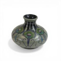 Moorcroft squat vase decorated in the Peacock parade design, dated 2012, h.11.5cm.